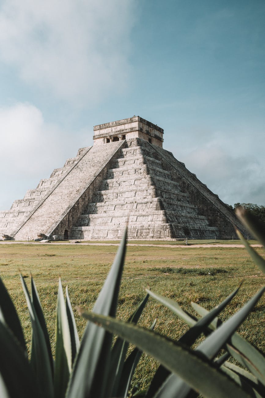 gray pyramid on grass field during day